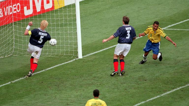 1998 World Cup Finals, St Denis, Paris, 10th June, 1998, Brazil 2 v Scotland 1, Scotland's Tommy Boyd (3) concedes an own goal for Brazil's winner as Cafu (R) celebrates  (Photo by Popperfoto via Getty Images/Getty Images)