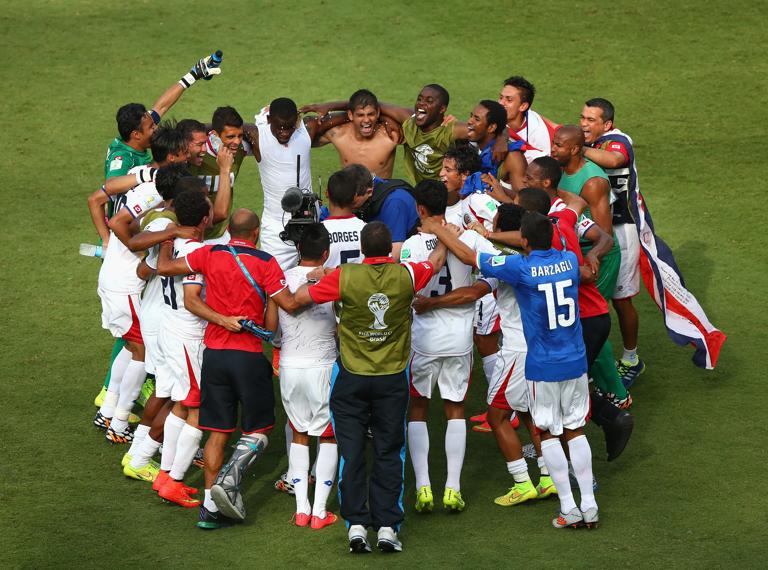 RECIFE, BRAZIL - JUNE 20: Costa Rica players huddle on the field and celebrate the 1-0 victory in the 2014 FIFA World Cup Brazil Group D match between Italy and Costa Rica at Arena Pernambuco on June 20, 2014 in Recife, Brazil. (Photo by Michael Steele/Getty Images)