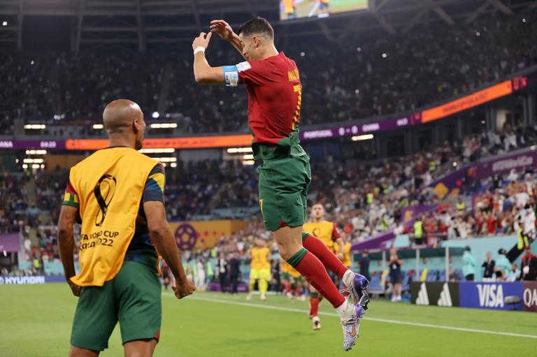 DOHA, QATAR - NOVEMBER 24: Cristiano Ronaldo of Portugal celebrates after scoring their team's first goal via a penalty during the FIFA World Cup Qatar 2022 Group H match between Portugal and Ghana at Stadium 974 on November 24, 2022 in Doha, Qatar. (Photo by Clive Brunskill/Getty Images)