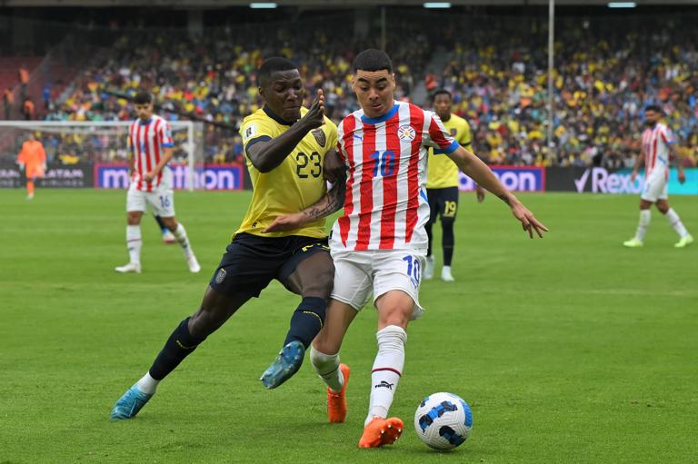 Ecuador's midfielder Moises Caicedo (L) and Paraguay's midfielder Miguel Almiron fight for the ball during the 2026 FIFA World Cup South American qualifiers football match between Ecuador and Paraguay, at the Rodrigo Paz Delgado stadium in Quito, on October 10, 2024. (Photo by Rodrigo BUENDIA / AFP) (Photo by RODRIGO BUENDIA/AFP via Getty Images)