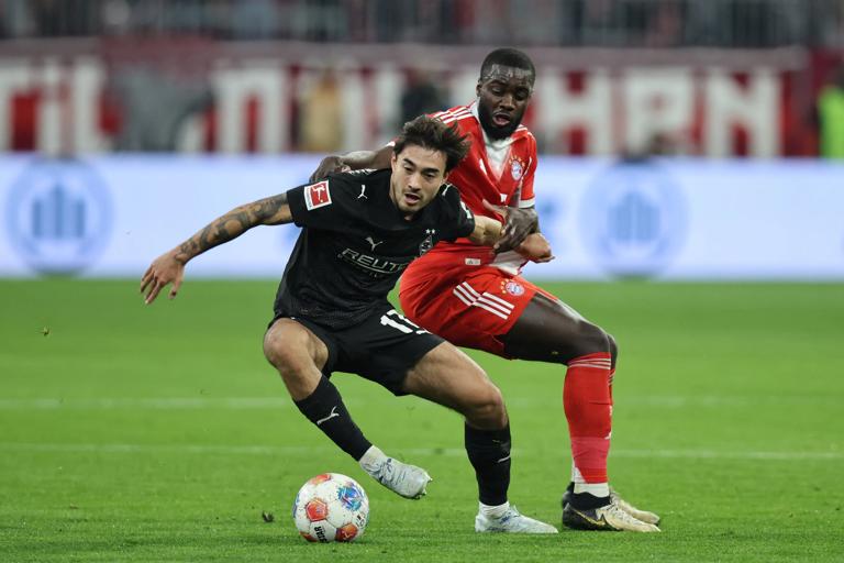 Moenchengladbach's German-South Korean midfielder #17 Jens Castrop and Bayern Munich's French defender #02 Dayot Upamecano vie for the ball during the German first division Bundesliga football match between FC Bayern Munich and Borussia Moenchengladbach in Munich, southern Germany, on March 6, 2026. (Photo by Alexandra BEIER / AFP via Getty Images) / DFL REGULATIONS PROHIBIT ANY USE OF PHOTOGRAPHS AS IMAGE SEQUENCES AND/OR QUASI-VIDEO