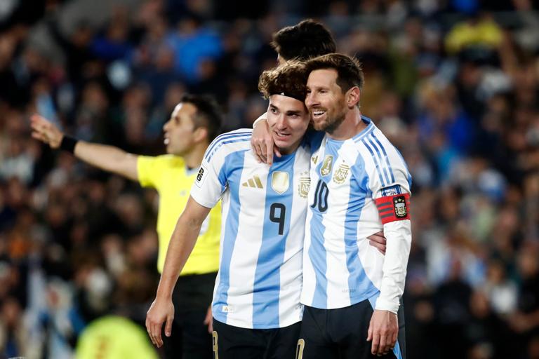 BUENOS AIRES, ARGENTINA - SEPTEMBER 04: Lionel Messi of Argentina celebrates with teammate Julian Alvarez after scoring the team's first goal during the South American FIFA World Cup 2026 Qualifier match between Argentina and Venezuela at Estadio Más Monumental Antonio Vespucio Liberti on September 04, 2025 in Buenos Aires, Argentina. (Photo by Marcos Brindicci/Getty Images)