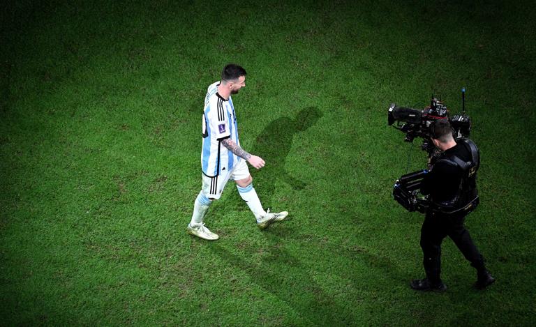 LUSAIL CITY, QATAR - DECEMBER 18: Lionel Messi of Argentina walks to the stage in the trophy presentation after the FIFA World Cup Qatar 2022 Final match between Argentina and France at Lusail Stadium on December 18, 2022 in Lusail City, Qatar. (Photo by Matthias Hangst/Getty Images)
