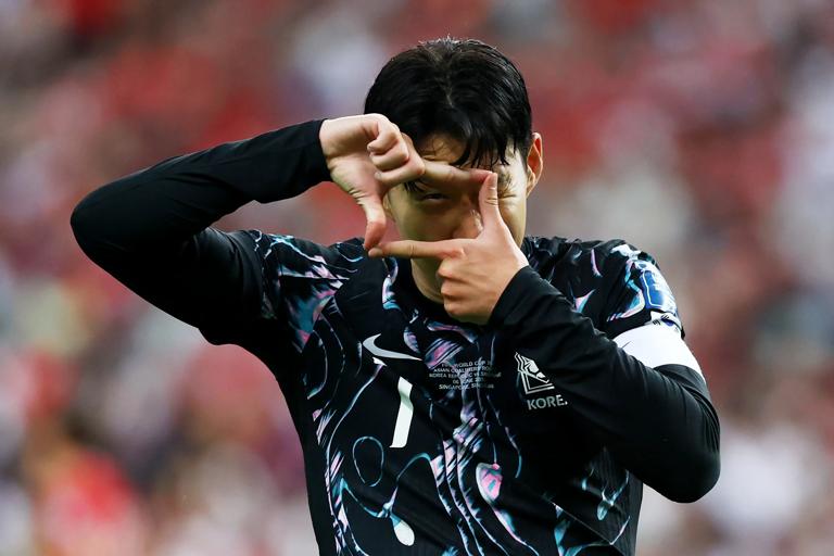 SINGAPORE, SINGAPORE - JUNE 06: Son Heung-min #7 of South Korea celebrates after scoring his team's third goal against Singapore in the second half during the FIFA World Cup Asian 2nd qualifier match at the National Stadium on June 06, 2024 in Singapore. (Photo by Yong Teck Lim/Getty Images)