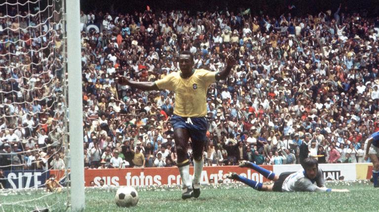 1970 World Cup Final, Mexico City, Mexico, 21st June, 1970, Brazil 4 v Italy 1, Pele raises his arms as he celebrates his captain Carlos Alberto's fourth goal with teammate Jairzinho (R) as Italian goalkeeper Enrico Albertosi lies beaten on the ground during the match (Photo by Rolls Press/Popperfoto via Getty Images/Getty Images)